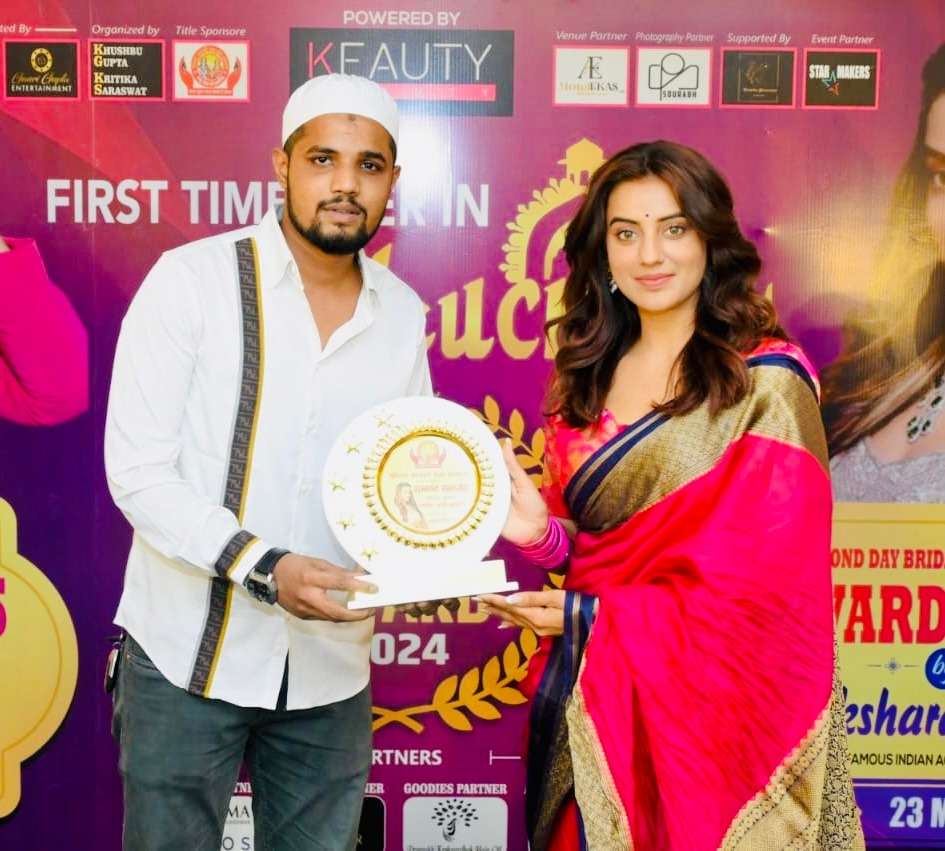 Wahid Biryani receiving an award at an event